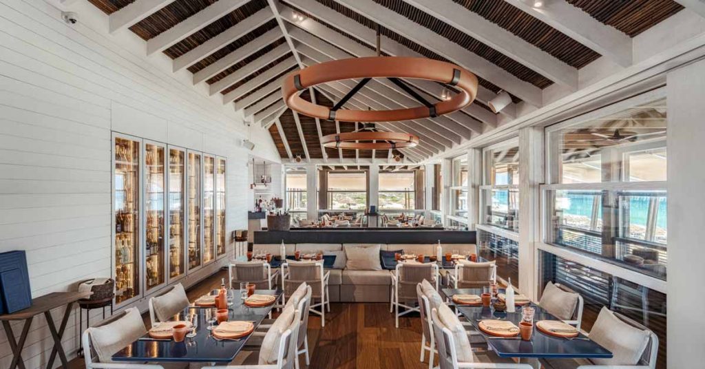 JNCQUOI Beach Club with solid wood beams interior.